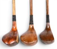3x Socket neck woods in stained persimmon an H Wilson driver and Auchterlonie small headed driver