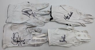 4x Used Golf Gloves signed by Brett Rumford, Mark Warren, Bill Haas, K Aphibarnrat