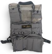Marc Petitjean fishing vest with detachable back pockets. The vest has various detachable units to