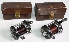 2x ABU Ambassadeur 6000C multiplier reels stamped 057100 and no foot stamp, both in black finish,