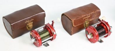 Pair of Abu Ambassador 6000 multiplier reels, both 4 screw end plates, white handles, free spools,