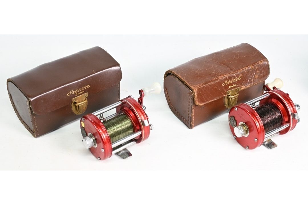 Pair of Abu Ambassador 6000 multiplier reels, both 4 screw end plates, white handles, free spools, - Image 1 of 2