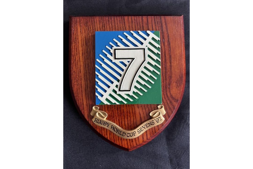 1997 RWC Sevens Classic Shield Shaped Rugby Wall Plaque: Brown with colourful IRB RWC logo and
