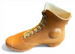 19thc Ceramic Rugby Boot: Delicately designed and crafted in golden tan, black and white with