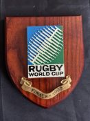 1999 RWC Classic Shield Shaped Rugby Wall Plaque: Brown with colourful IRB RWC logo and title/date