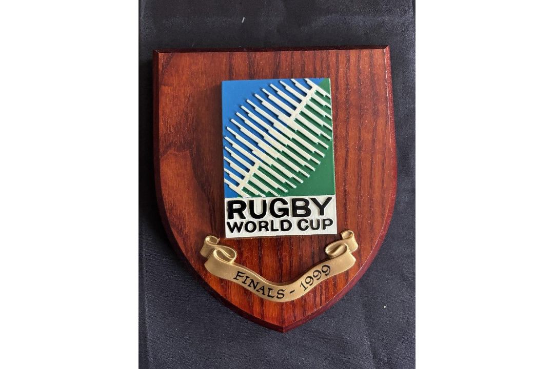 1999 RWC Classic Shield Shaped Rugby Wall Plaque: Brown with colourful IRB RWC logo and title/date