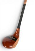 Walter Hagen stripe top driver with central brass sole plate fitted with a full length original grip