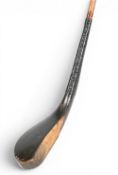 c1870 McEwan long nose hooked faced play club in dark stained fruitwood head measures 6” x 1 1/8”