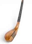 Jack Morris golden beechwood long nose driver c1885 fitted with central leather face insert and