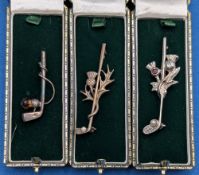 3x Scottish Thistle Golf Brooches, one silver, 2 plated silver