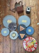 A collection of assorted 9.5mm film reels including some of Mickey Mouse interest and slapstick