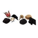 A collection of assorted vintage gents hats including a deer stalker, graduation hat, top hat and