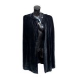 Three Clerical cloaks including a 'House of Vanheems' Clerical Cloak, the woollen cloak featuring