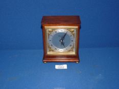 An Elliot of London Mahogany clockwork mantle clock with brass spandrels,