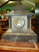 A heavy slate mantle clock in classical style having a two-train spring driven movement striking on