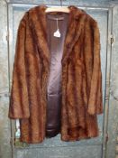 A ladies short mink fur Coat, unlabelled, small/medium size with hook and eye fastening.