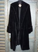 A vintage ladies black panne velvet and frogging coat, size medium.