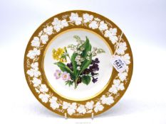 A Meissen cabinet plate, circa 1820-30, rare bisque vine border and finely painted bouquet,
