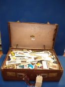 A vintage 'Dreadnought' suitcase full of Matchboxes and match books,
