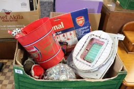 A box of Arsenal Football Club memorabilia.