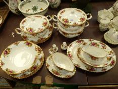 A Royal Albert 'Old Country Roses' dinner service including three lidded serving dishes,