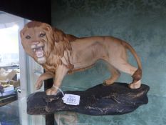 A matt finish Beswick large lion on a rock figurine, 8 1/2" high x 12" long x 4 1/2" deep.