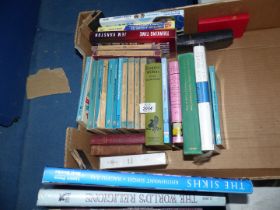 A quantity of books to include religious books, Pelican books etc.