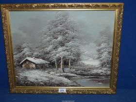 A framed oil on canvas of a winter landscape with snow covered cottage by a river with frosted