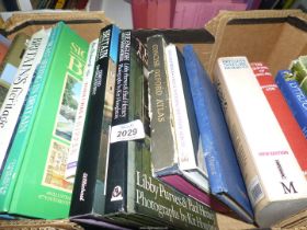 A box of coffee table books including Britain's Heritage, New Country Kitchens,