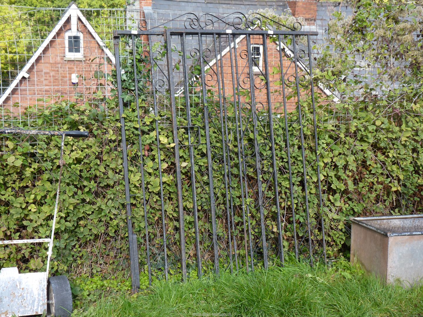 A pair of wrought iron grates, 45