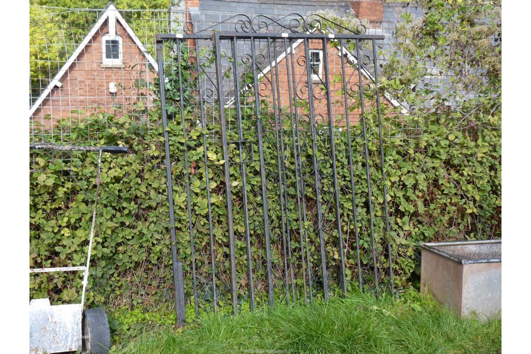 A pair of wrought iron grates, 45