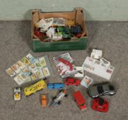 A box of collectables to include assorted cigarette cards, remote control car and quantity of