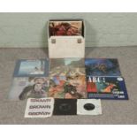 A carry case of assorted single and LP vinyl records. To include The Beatles, Wings, The Moody