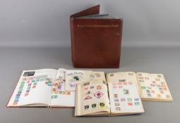 A folder containing mainly Royal Mail mint stamps presentation packs, together with four partially