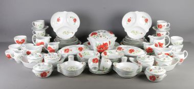 A comprehensive Royal Worcester dinner service in the 'Poppies' pattern. Including teapot, teacups