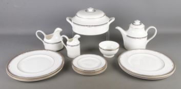 A Royal Doulton part dinner service in the Musicale design. Including tureen, teapot, cream jug