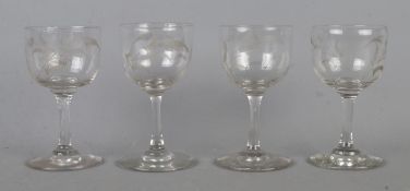 A set of four Victorian port/sherry glasses, having engraved fern leaves to the bowl. Height: 10.