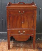 A Georgian mahogany commode, the tray top above a short drawer, with a pair of plain field