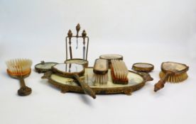A 1920s dressing table set with Japanese style decoration, includes trays, brushes, pots, manicure