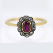 A ruby and diamond cluster ring, set in 18ct yellow gold, with inscription to inside band, size K/