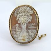 A large cameo brooch set in 9ct yellow gold, featuring a scenic view, approx 21g.
