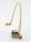 A 9ct gold chain set with a pendant and a pair of old cut diamond earrings, weight of chain approx