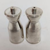A pair of modern silver salt and pepper grinders, hallmarked London, total weight approx. 9.5oz.