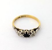 A diamond and sapphire dress ring, set in 18ct yellow gold, size L/M, approx 2.3g.