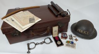 A collection of mid twentieth century and WWII police artefacts relating to the Police Constable