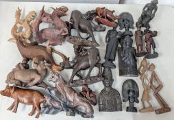 A collection of carved wood figures and animals, to include dragon, Komodo dragon, tiger, etc.
