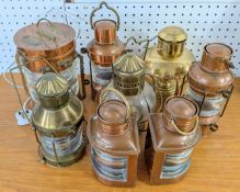 A collection of Ships lanterns, of copper and brass frames, to include one with a converted lamp