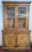 A 19th century walnut Library Bookcase, with elaborate gilt ormolu decoration to sides, glazed