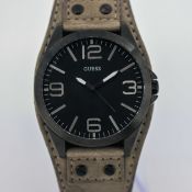 Guess, a gent's large dress watch on a light brown leather strap, together with two dress watches,