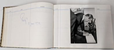 Of HRH Prince Philip interest: A visitors book, of gilt blue leather containing the signature of HRH